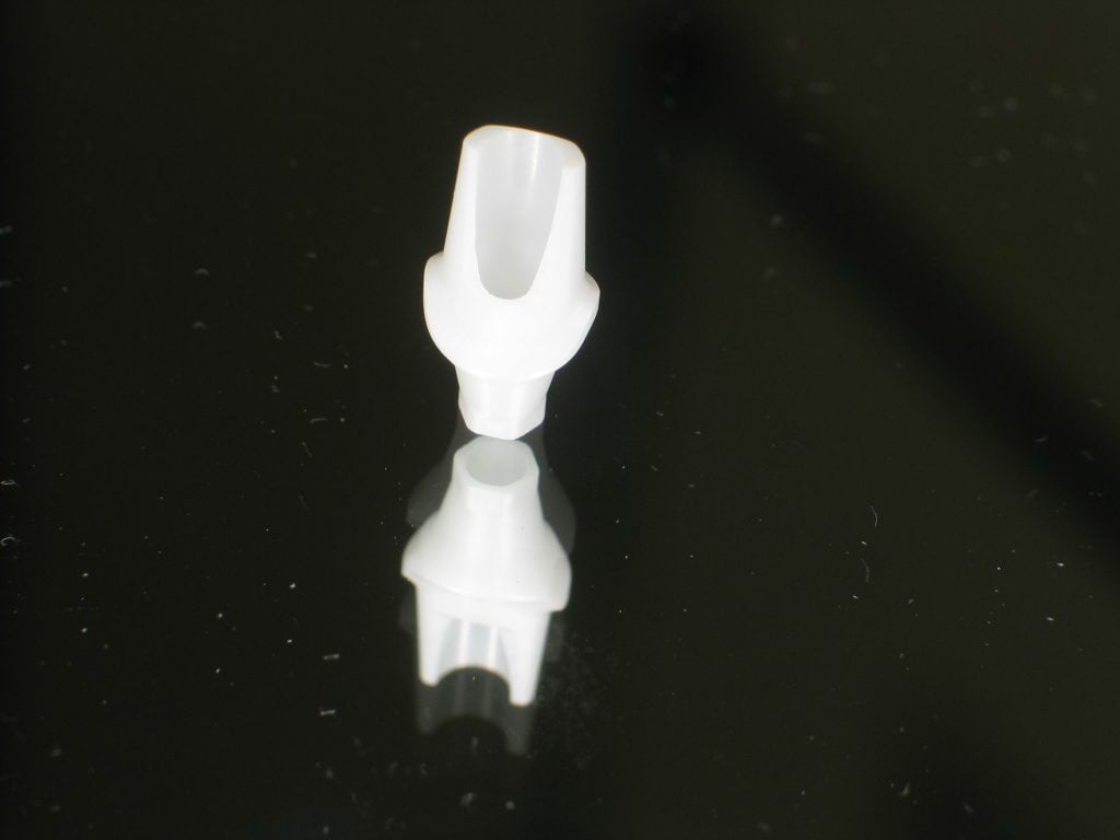 View of Zirconia abutment that is attached to the implant. 